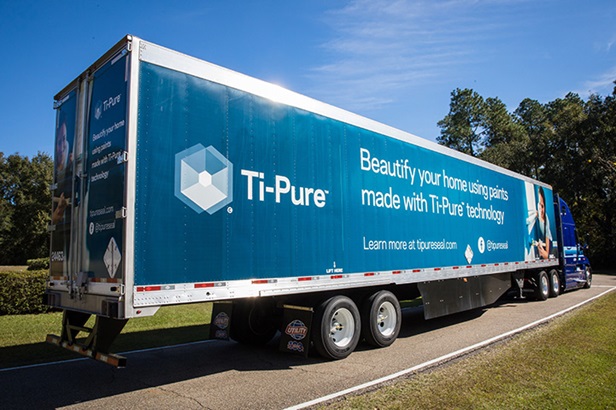 blue tipure truck on green road