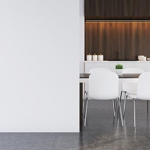 brown and white table and white chairs against white wall in brown modern kitchen