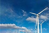 Series of windmills under a blue sky