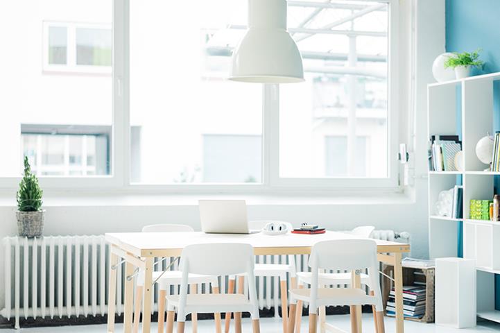 open room with table and chairs blue wall detail