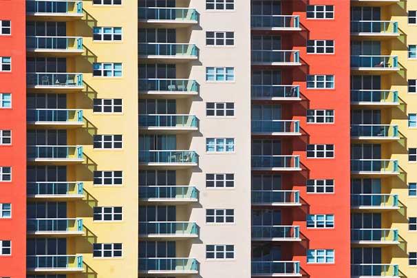 Apartment building with five sections of color