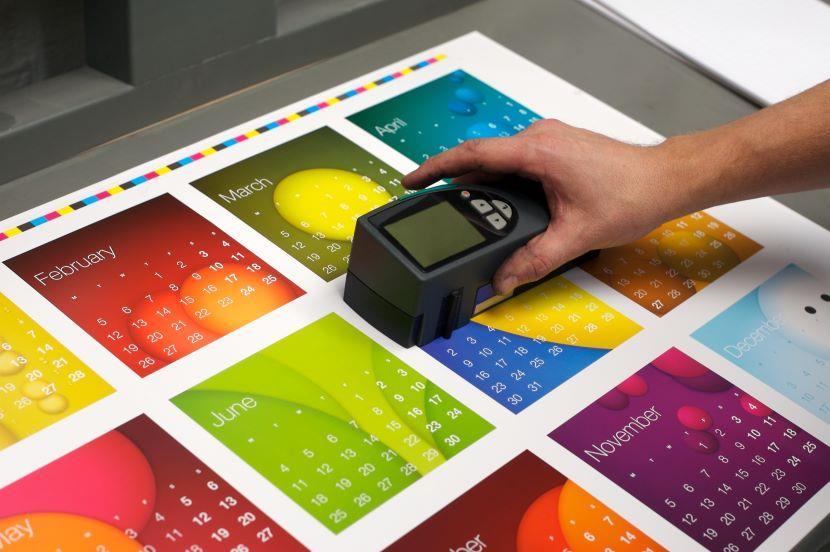 person using device check quality of paper