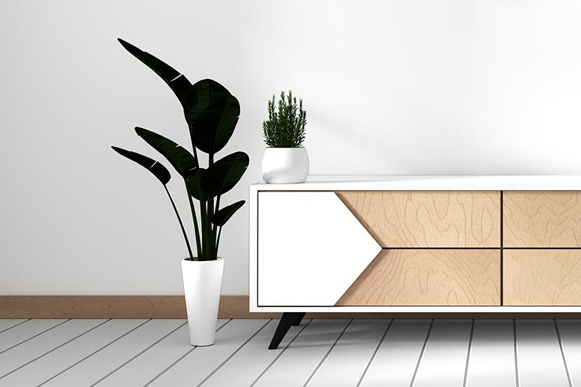 modern white laminate tv cabinet with plants on either side