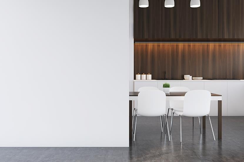 brown and white table and white chairs against white wall in brown modern kitchen