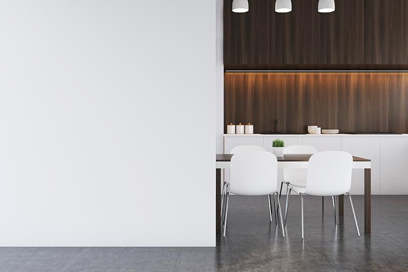 brown and white table and white chairs against white wall in brown modern kitchen