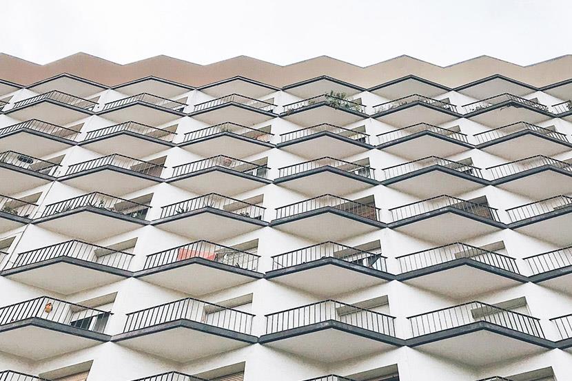 front facade of apartment building with balconies